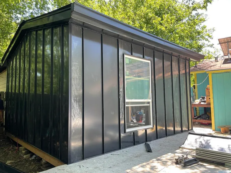 Black standing seam metal wall panels for Roof Inspection in Grass Lake