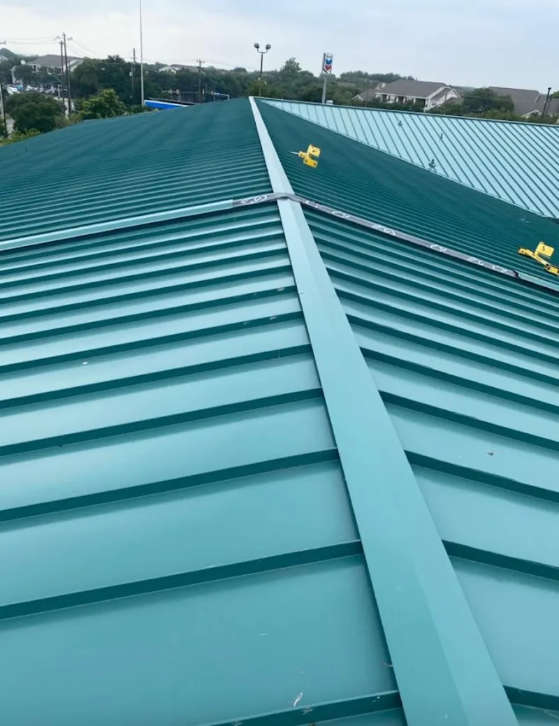 Green commercial metal roof ridge and valley for Metal Roof Repair in Grass Lake